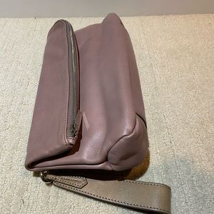 Genuine leather dusty mauve folding clutch/wristlet.
